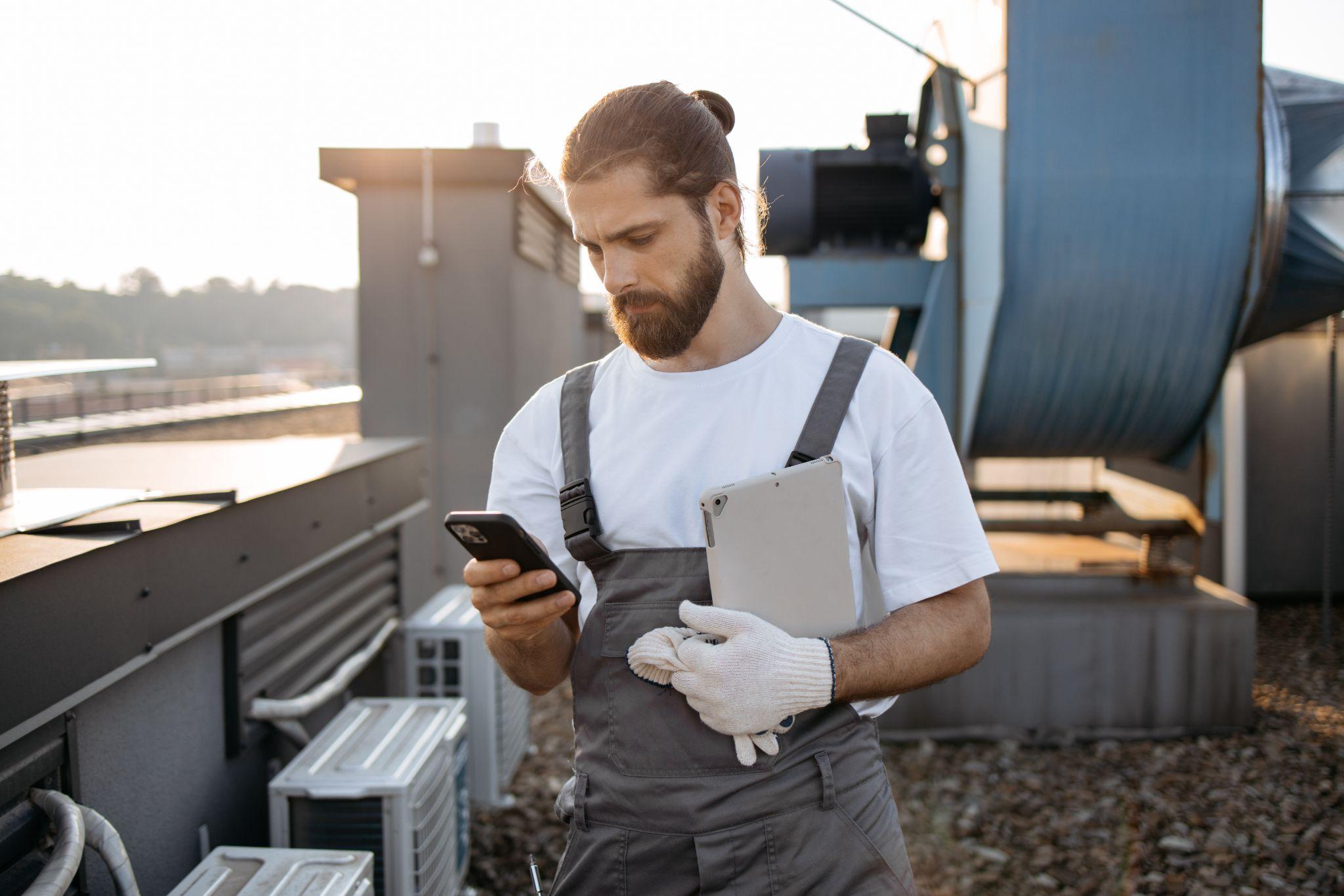 Technician sending a compliant Google review request by text after an HVAC service call